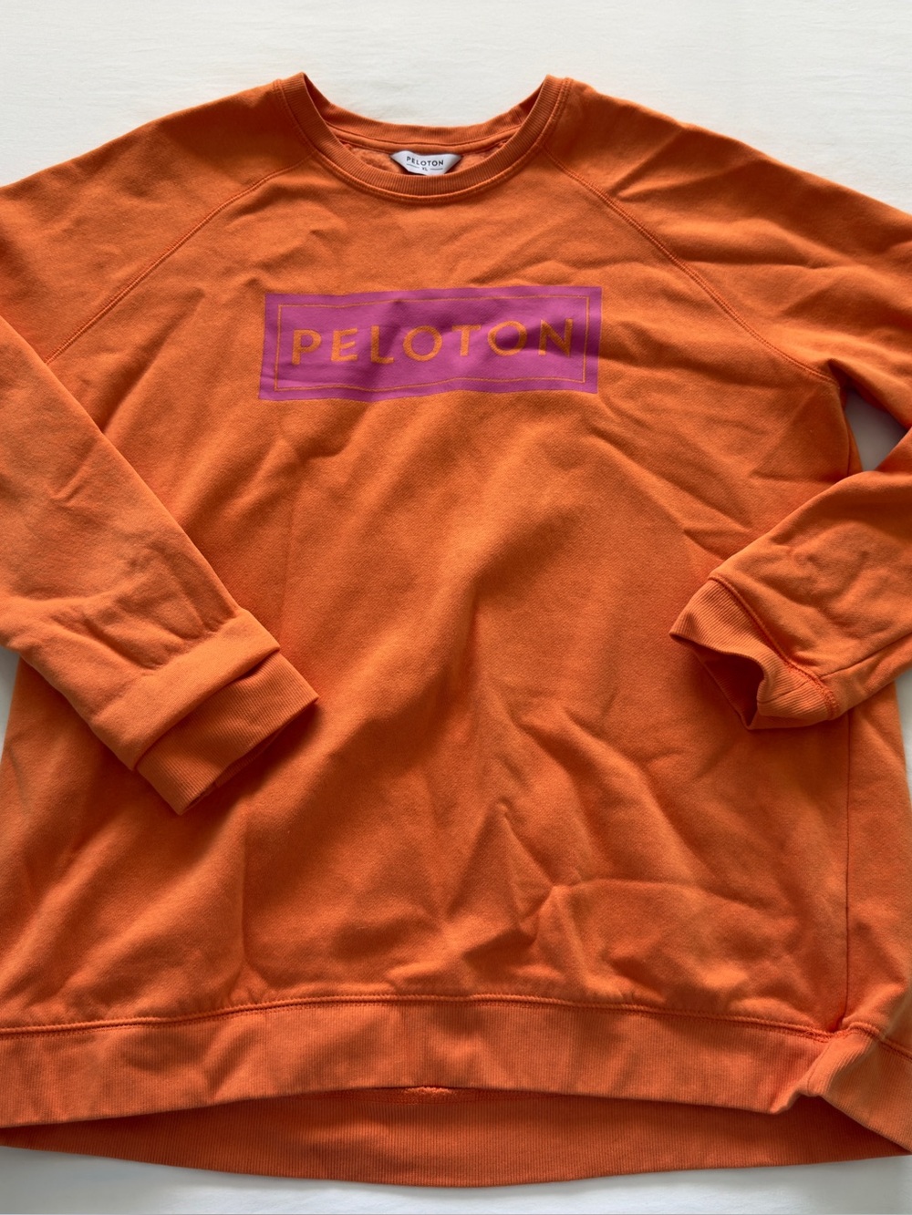 Peloton Orange Crewneck Sweatshirt with Pink Logo